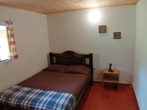 Postel nebo postele na pokoji v ubytování Nuestro Bosque I