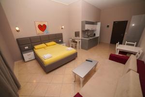 Postel nebo postele na pokoji v ubytování Apartments Serxhio