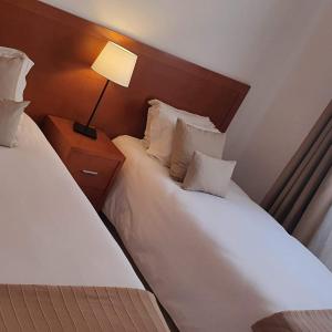 Ένα ή περισσότερα κρεβάτια σε δωμάτιο στο Apartamentos Cabrita