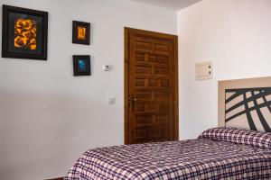 Katil atau katil-katil dalam bilik di Suites Trastámara