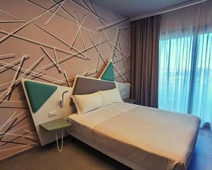 Postel nebo postele na pokoji v ubytování Saracen Sands Hotel & Congress Centre - Palermo