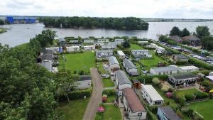 an aerial view of a village next to a river at Tiny Camping Pod in Warmond