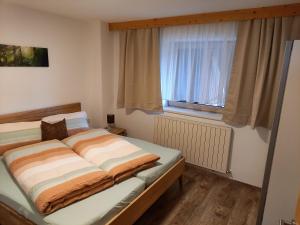 Postel nebo postele na pokoji v ubytování Ferienwohnung Regensburger