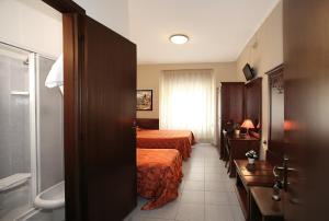 Letto o letti in una camera di Hotel Pavone