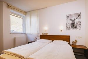 Łóżko lub łóżka w pokoju w obiekcie Der Gletscherblick by Alpin Rentals - incl Summercard