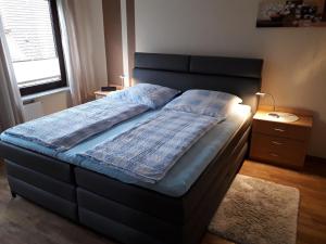 Säng eller sängar i ett rum på Ferienhof Kantereit