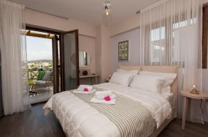 Ένα ή περισσότερα κρεβάτια σε δωμάτιο στο Villa Harmony-Crete Residences  +61 φωτογραφίες