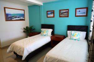 Postel nebo postele na pokoji v ubytování Grace Wave Resort