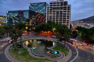 a city with a fountain in the middle of a street at Fountains Hotel in Cape Town