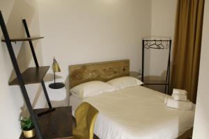 Postel nebo postele na pokoji v ubytování Domino Hotel