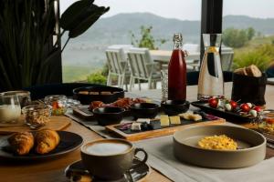 a table with food and drinks on it at Tavarneta Estate in Dobrovo