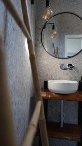 a bathroom with a sink and a mirror at Zab Living in Vila de Rei +42 photos