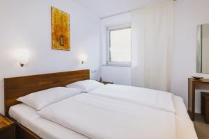 Łóżko lub łóżka w pokoju w obiekcie Der Gletscherblick by Alpin Rentals - incl Summercard