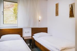 Łóżko lub łóżka w pokoju w obiekcie Der Gletscherblick by Alpin Rentals - incl Summercard