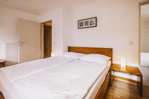 Łóżko lub łóżka w pokoju w obiekcie Der Gletscherblick by Alpin Rentals - incl Summercard