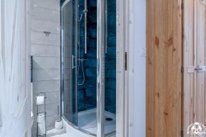 a shower with a glass door in a bathroom at Agroturystyka Corno Owca in Żabnica
