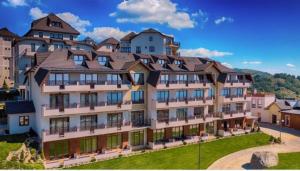 a large building with a roof on top of it at Milmari Premier40 in Kopaonik