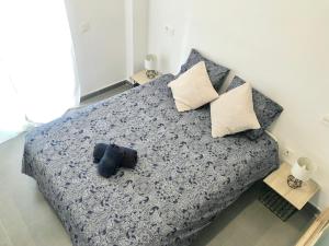 เตียงในห้องที่ Varela apartamentos B