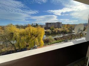 a view of a river from a balcony at Vilhelmov’s apartament in Lukovit +11 photos