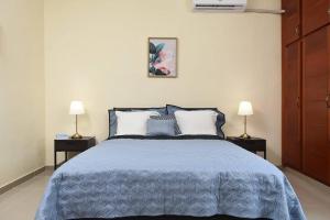 Postel nebo postele na pokoji v ubytování Maravilloso Apto en Santo Domingo
