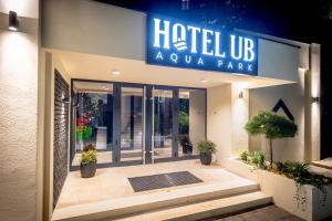 a hotel entrance with a sign that reads hotel up acula park at Hotel Ub Aqua Park in Ub