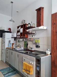 A kitchen or kitchenette at Casa Le Papillon