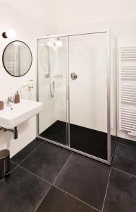 a bathroom with a shower and a sink at Rosa Apartment with parking historic city center in Merano