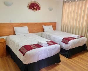 Postel nebo postele na pokoji v ubytování Hostal Casona Arrambide