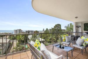 a balcony with chairs and a view of the ocean at Canberra Heights Unit 2 35 Canberra Tce Kings Beach in Caloundra