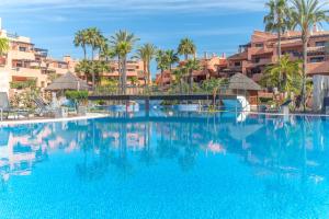 The swimming pool at or close to High standard beach front apartment