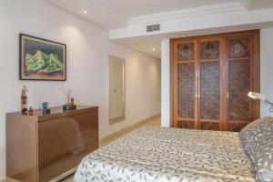 A bed or beds in a room at High standard beach front apartment