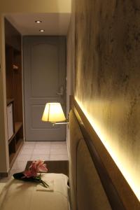 Postel nebo postele na pokoji v ubytování Achilles Hotel