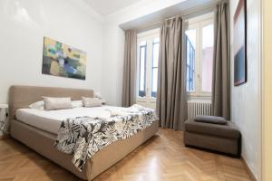Postel nebo postele na pokoji v ubytování Dimora storica Palazzo Marescalchi Belli