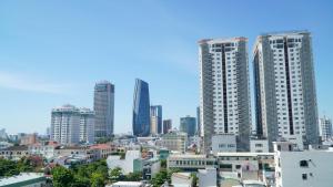 a city skyline with tall buildings in the background at Bao Ngoc Hotel & Apt in Danang