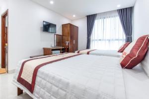 Voodi või voodid majutusasutuse Bao Ngoc Hotel & Apt toas