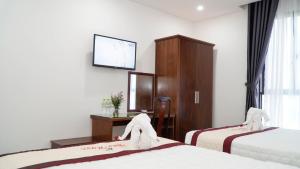 Voodi või voodid majutusasutuse Bao Ngoc Hotel & Apt toas