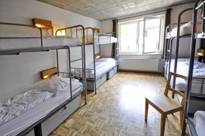 Ένα ή περισσότερα κρεβάτια σε δωμάτιο στο Five Elements Hostel and Capsules Frankfurt