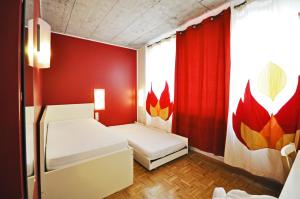Ένα ή περισσότερα κρεβάτια σε δωμάτιο στο Five Elements Hostel and Capsules Frankfurt