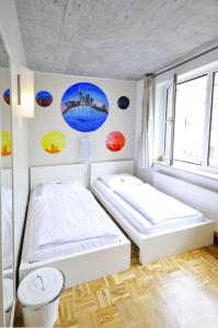 Ένα ή περισσότερα κρεβάτια σε δωμάτιο στο Five Elements Hostel and Capsules Frankfurt