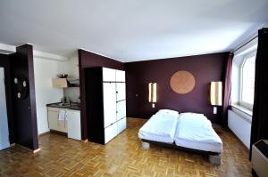 Ένα ή περισσότερα κρεβάτια σε δωμάτιο στο Five Elements Hostel and Capsules Frankfurt