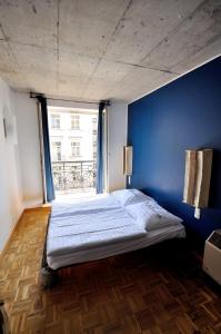 Ένα ή περισσότερα κρεβάτια σε δωμάτιο στο Five Elements Hostel and Capsules Frankfurt