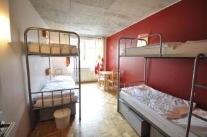 Ένα ή περισσότερα κρεβάτια σε δωμάτιο στο Five Elements Hostel and Capsules Frankfurt