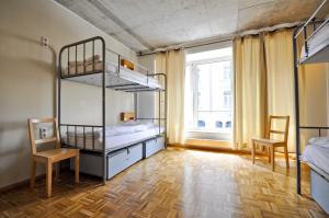 Ένα ή περισσότερα κρεβάτια σε δωμάτιο στο Five Elements Hostel and Capsules Frankfurt