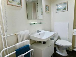 a bathroom with a sink and a toilet at Studio Chamrousse, 1 pièce, 4 personnes - FR-1-340-99 in Chamrousse