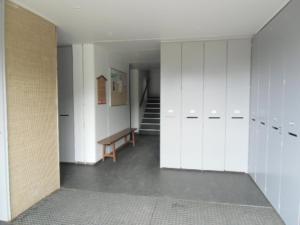 a locker room with white cabinets and a staircase at Studio Chamrousse, 1 pièce, 4 personnes - FR-1-340-108 in Chamrousse