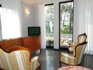 TV a/nebo společenská místnost v ubytování Hotel Moderno