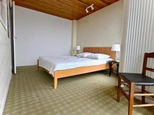 Кровать или кровати в номере Appartement Chamrousse, 3 pièces, 5 personnes - FR-1-340-196