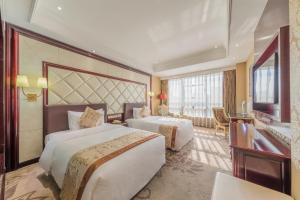 Postel nebo postele na pokoji v ubytování Sofis Jinyuan Hotel