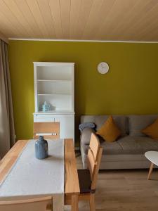 a living room with a couch and a table at Ferienwohnung Birka in Speyer