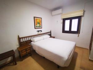 A bed or beds in a room at La Quinta De Santillan